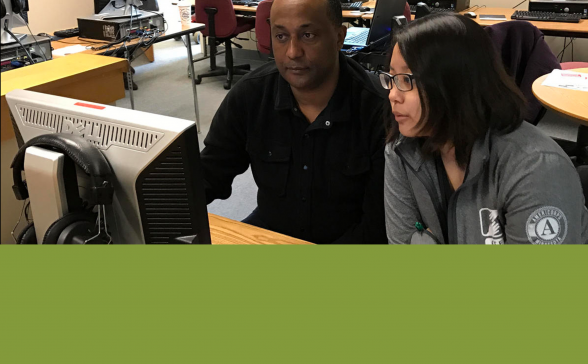 A photo of a CTEP AmeriCorps member helping a learner.