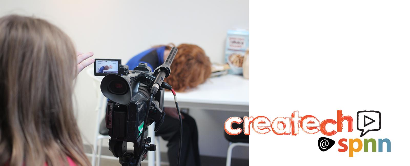 young girl running a camera with another girl sitting at a table with her head down. A graphic of Createch SPNN laid over the photo.